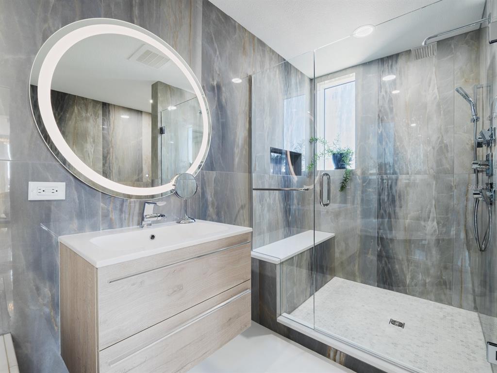 331 Cleveland Street, Unit 1101 Clearwater, FL 33755 - Photo 39 of 77 a bathroom with a sink and a mirror