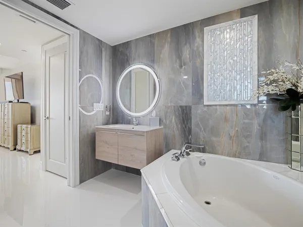 a view of a a dining room with furniture window and wooden floor