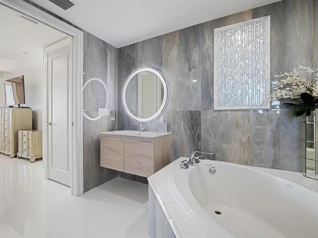 a view of a a dining room with furniture window and wooden floor