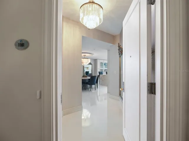a view of a hallway with washer and dryer