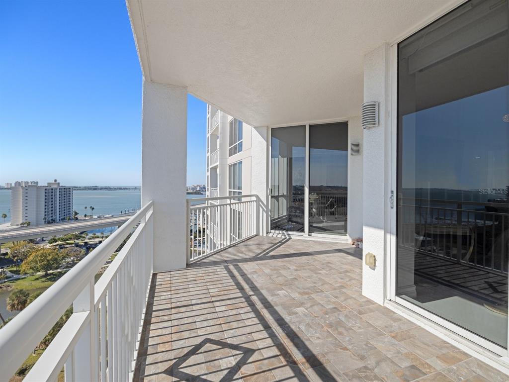 331 Cleveland Street, Unit 1101 Clearwater, FL 33755 - Photo 41 of 77 a view of a balcony with wooden floor and fence