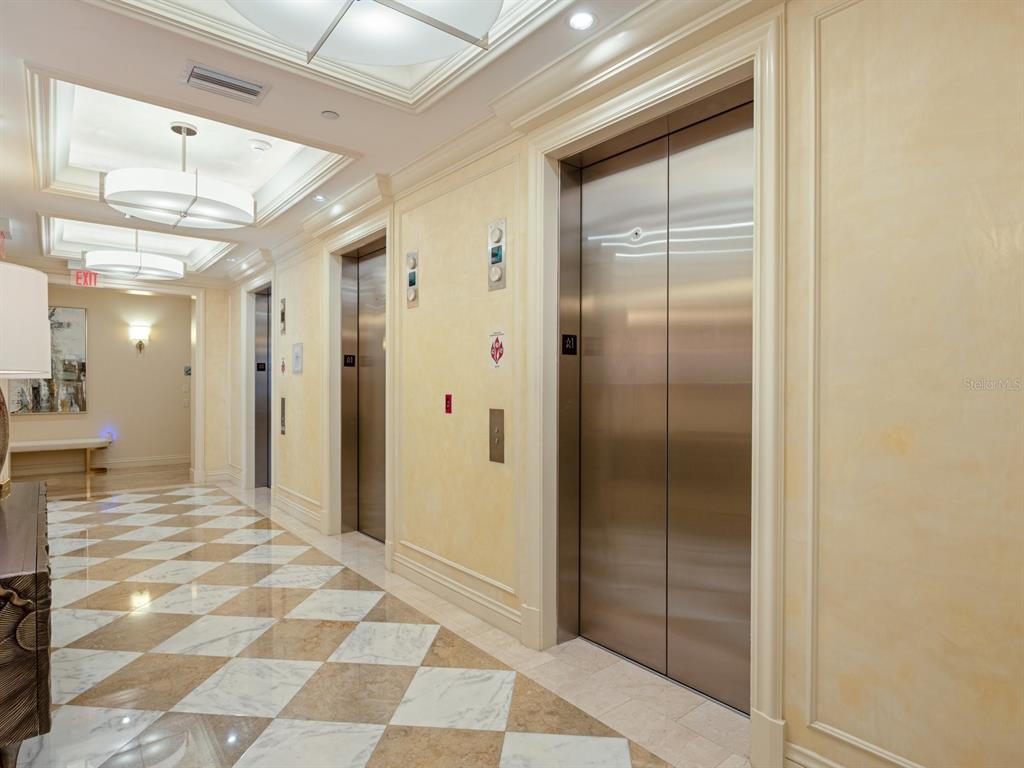 331 Cleveland Street, Unit 1101 Clearwater, FL 33755 - Photo 49 of 77 a bathroom with a glass shower door and a bathtub