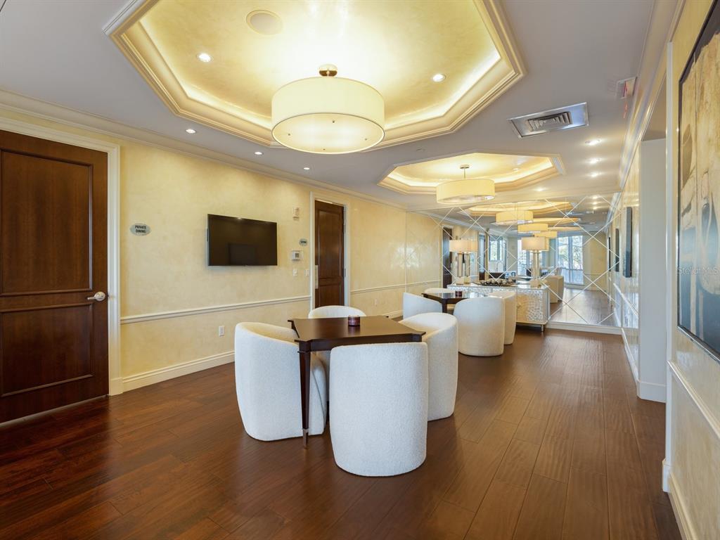 331 Cleveland Street, Unit 1101 Clearwater, FL 33755 - Photo 56 of 77 a living room with couches and a flat screen tv