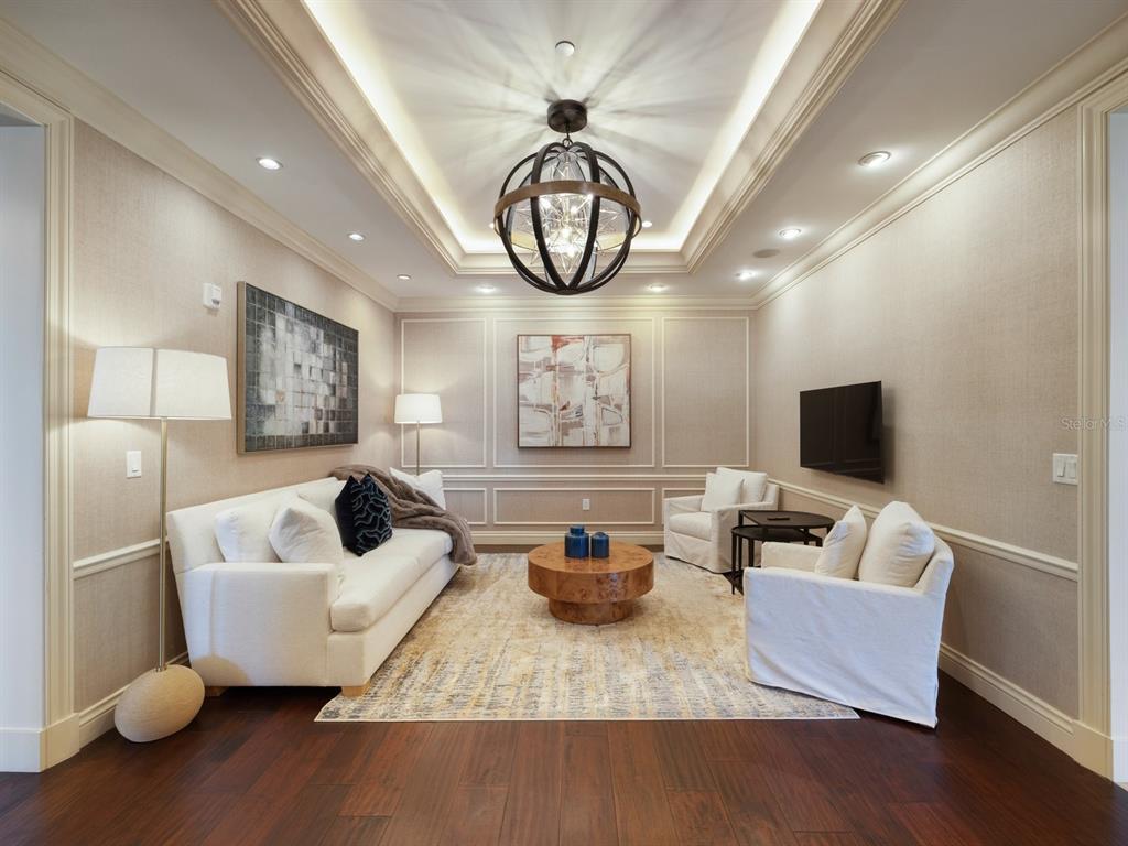 331 Cleveland Street, Unit 1101 Clearwater, FL 33755 - Photo 60 of 77 a living room with furniture and a flat screen tv