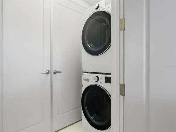 a bed room with a bed and a lamp