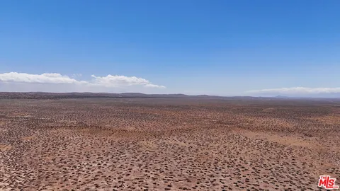 a view of an ocean & mountain