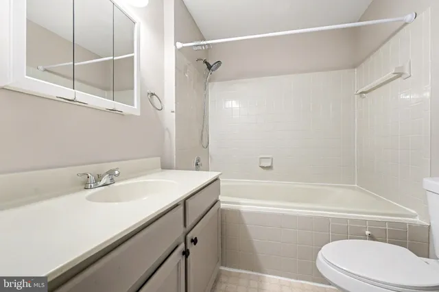 a bathroom with a sink a toilet and a bathtub