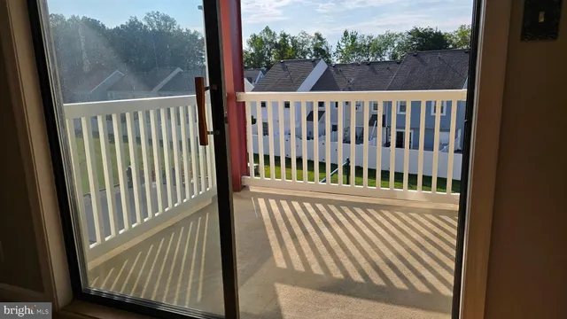 a view of a balcony with wooden floor