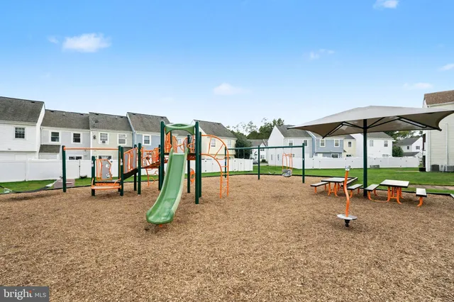 a view of a park with swings