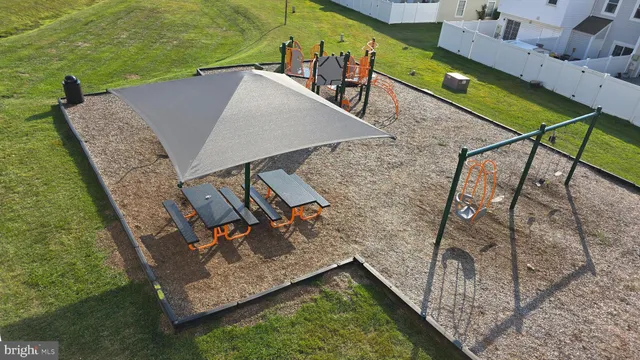 a view of a backyard with sitting area