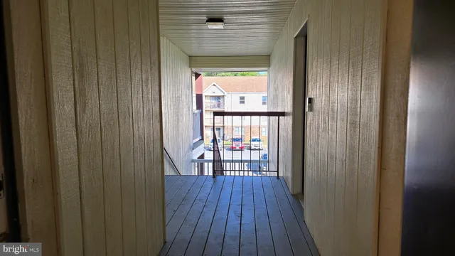 a view of a balcony with wooden floor