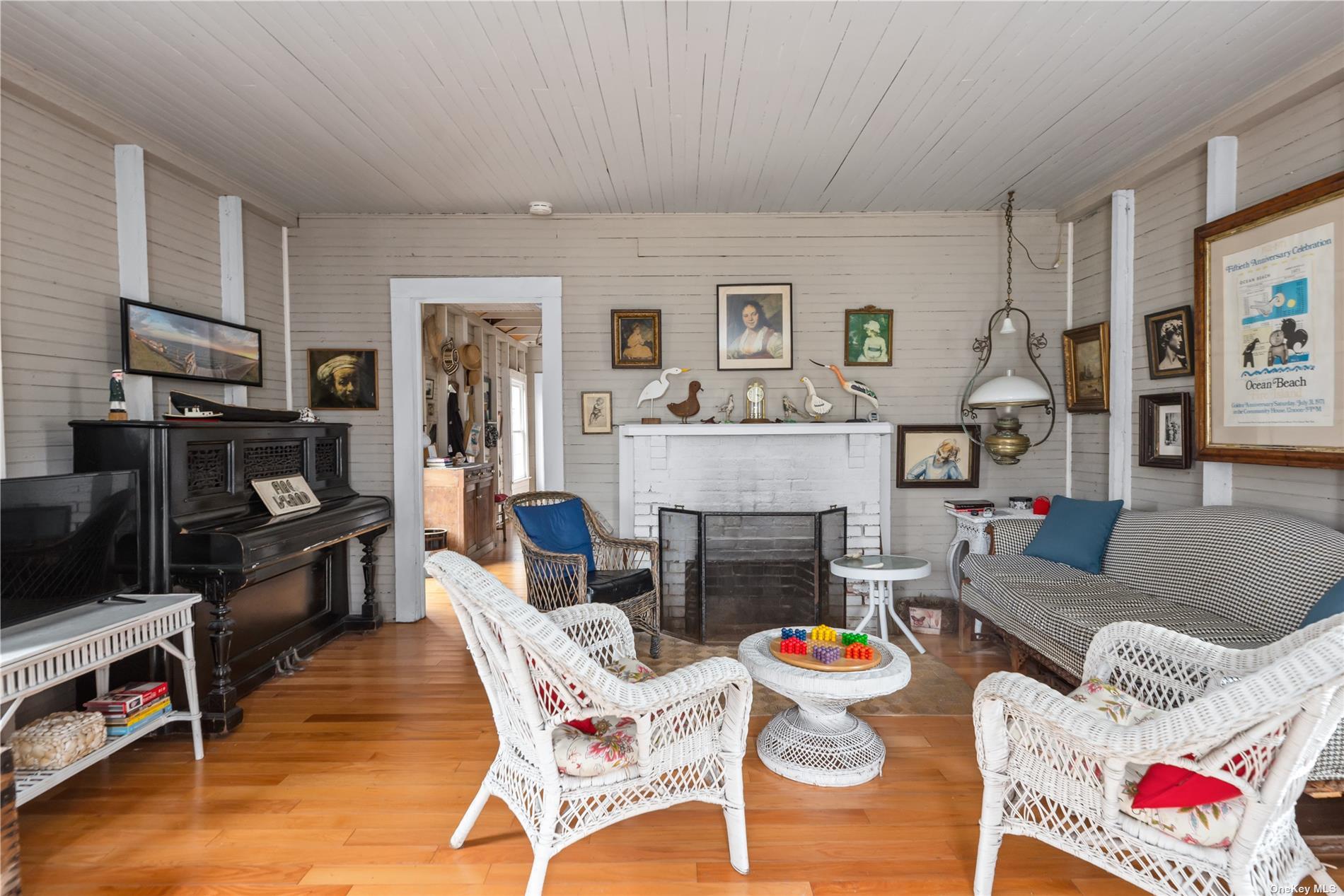20 Ocean Road Ocean Beach, NY 11770 - Photo 3 of 19 a living room with furniture and a fireplace