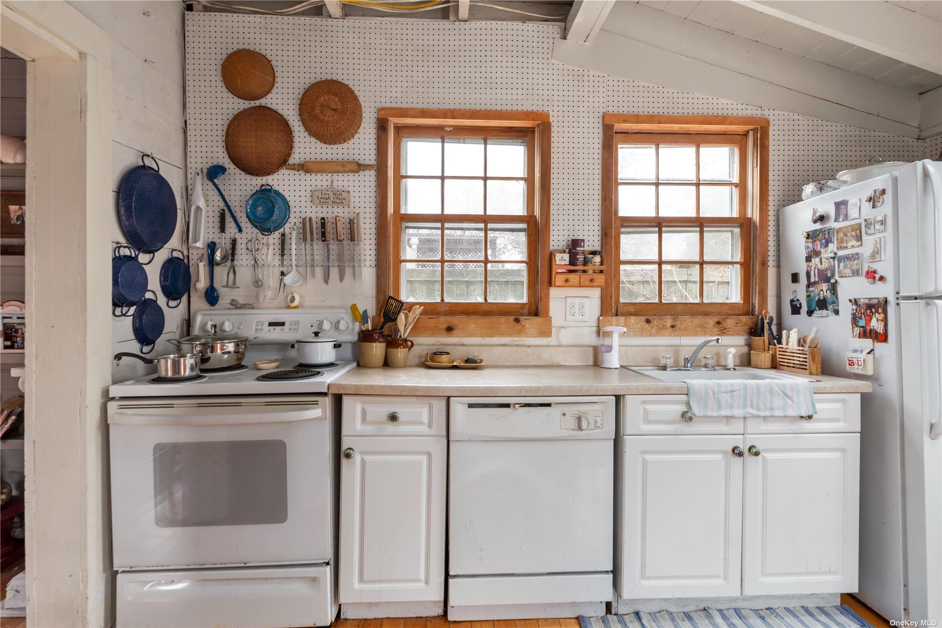 20 Ocean Road Ocean Beach, NY 11770 - Photo 5 of 19 a kitchen with cabinets and window