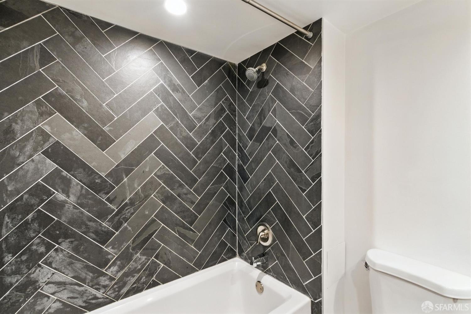 3256 16th Street, Unit 3 San Francisco, CA 94103 - Photo 11 of 16 a bathroom with a sink and toilet