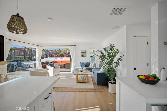 a kitchen with a stove and white cabinets