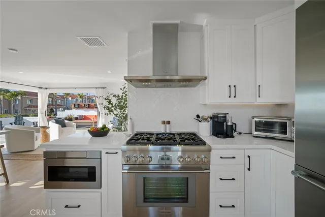 a spacious bedroom with a bed and a lamp