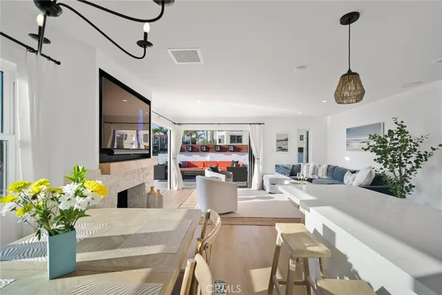 a spacious bedroom with a bed and a flat screen tv