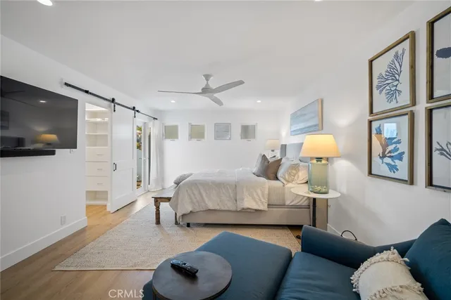 a large white bathroom with a double vanity sink a mirror and a shower