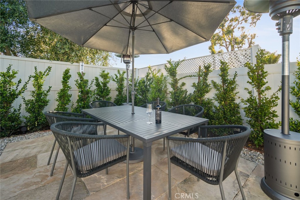 24272 Selva Road Dana Point, CA 92629 - Photo 34 of 59 a roof deck with table and chairs under an umbrella