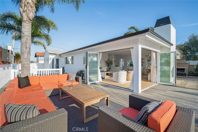 an aerial view of a house with garden space and street view
