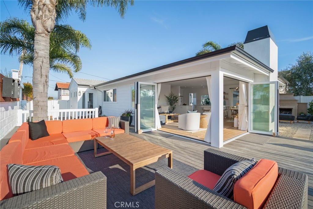 24272 Selva Road Dana Point, CA 92629 - Photo 40 of 59 a outdoor space with patio the couches and a dining table and chairs with potted plants