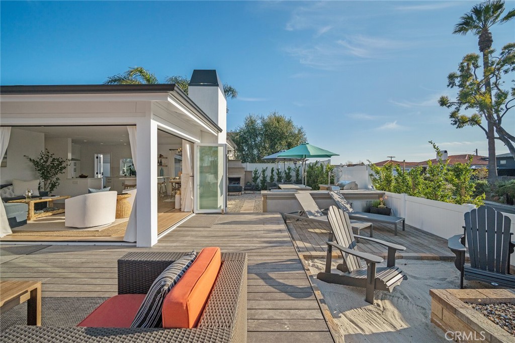 24272 Selva Road Dana Point, CA 92629 - Photo 41 of 59 a view of a patio with couches table and chairs and potted plants