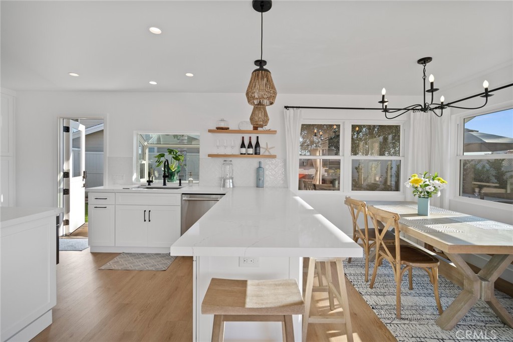 24272 Selva Road Dana Point, CA 92629 - Photo 10 of 59 a view of a dining room with furniture window and wooden floor