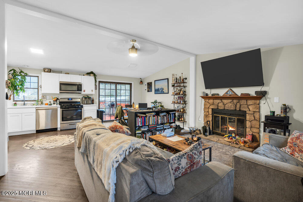 6 Mizzen Way Waretown, NJ 08758 - Photo 5 of 12 a living room with fireplace furniture and a flat screen tv