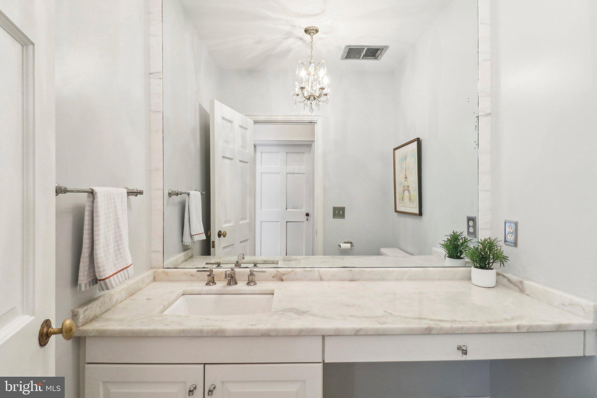 10650 Gunston Road Lorton, VA 22079 - Photo 31 of 73 a bathroom with a sink and a mirror