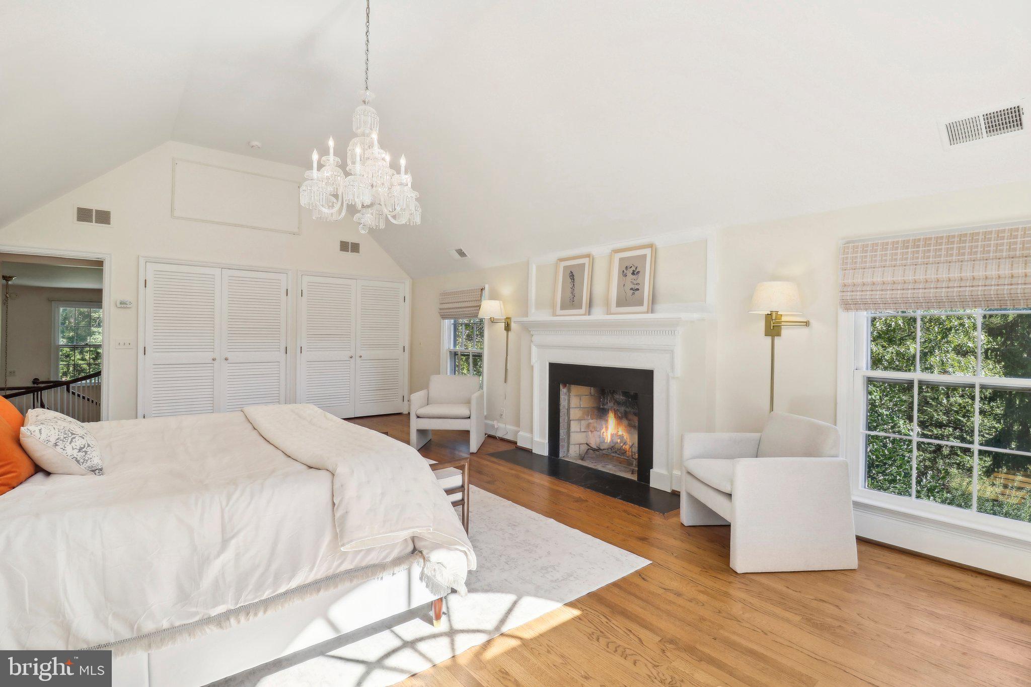 10650 Gunston Road Lorton, VA 22079 - Photo 37 of 73 a spacious bedroom with a bed and a fireplace