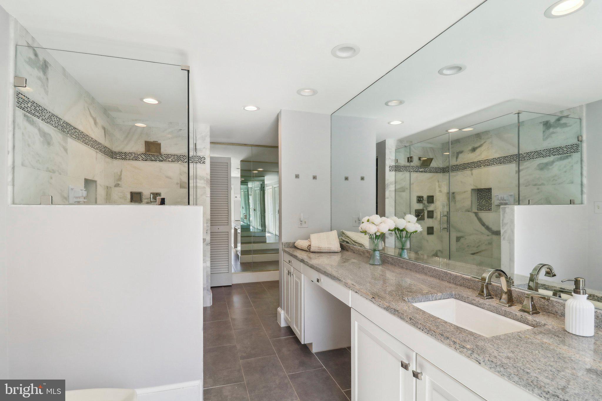 10650 Gunston Road Lorton, VA 22079 - Photo 40 of 73 a bathroom with a granite countertop sink mirror and double