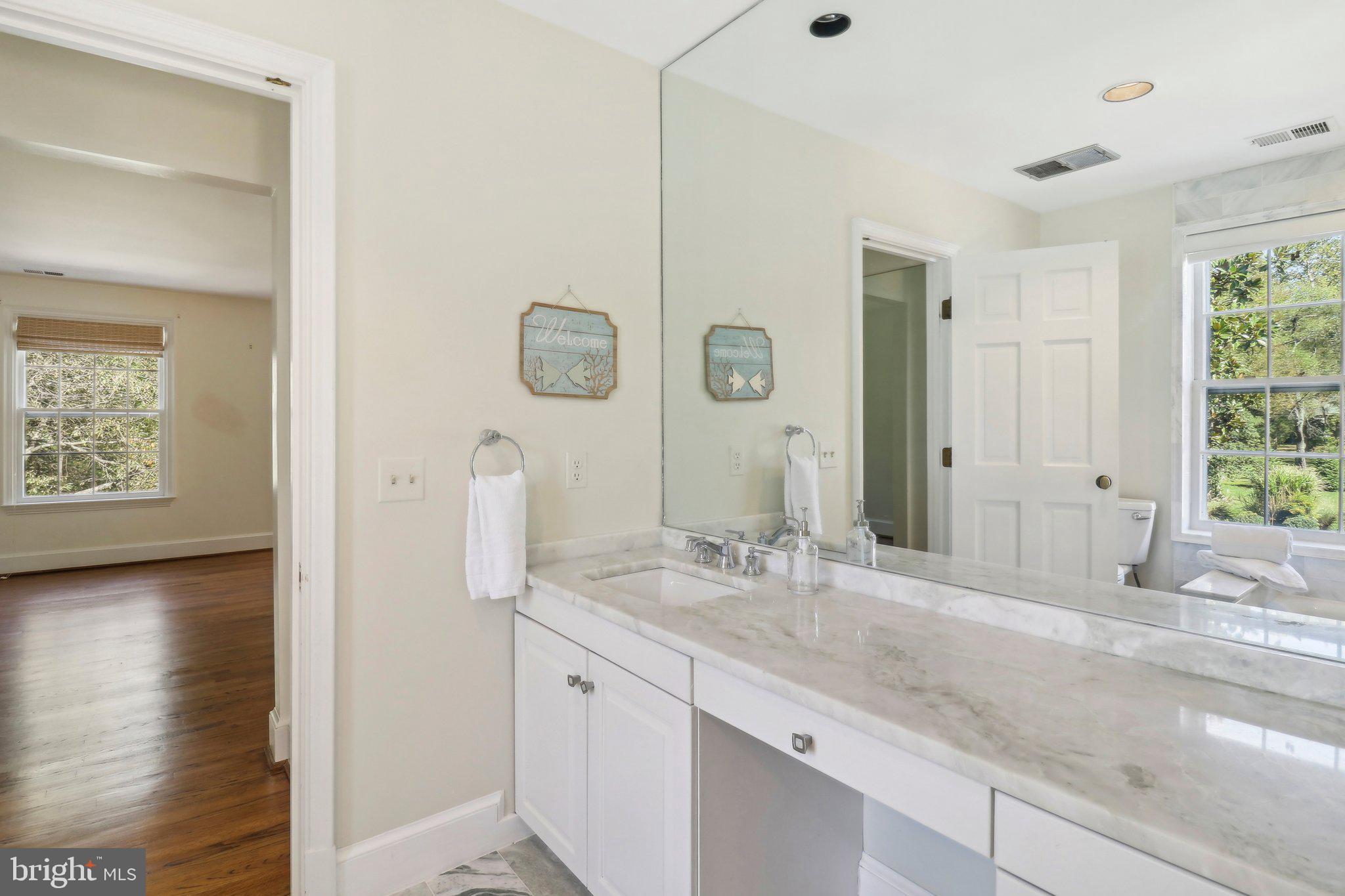 10650 Gunston Road Lorton, VA 22079 - Photo 49 of 73 a bathroom with a sink and a mirror