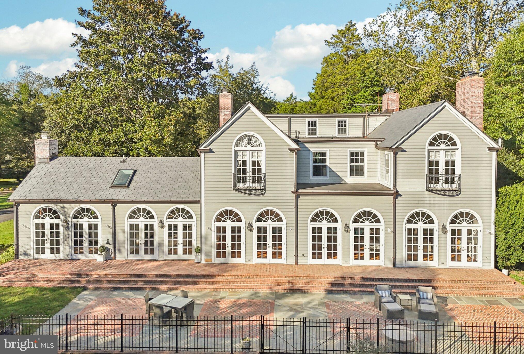 10650 Gunston Road Lorton, VA 22079 - Photo 58 of 73 a front view of a house with a yard and trees