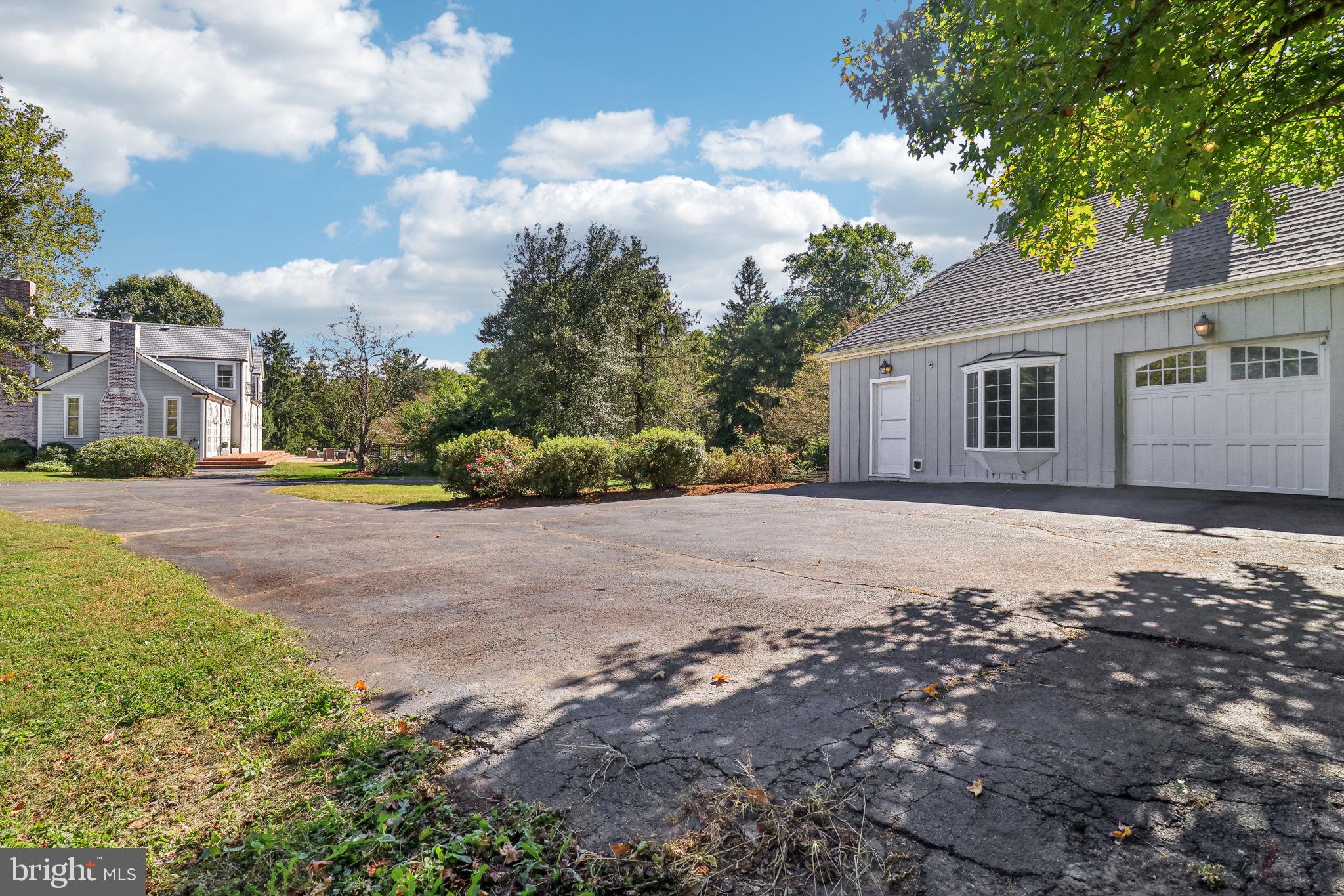 10650 Gunston Road Lorton, VA 22079 - Photo 64 of 73 a front view of a house with a yard and trees