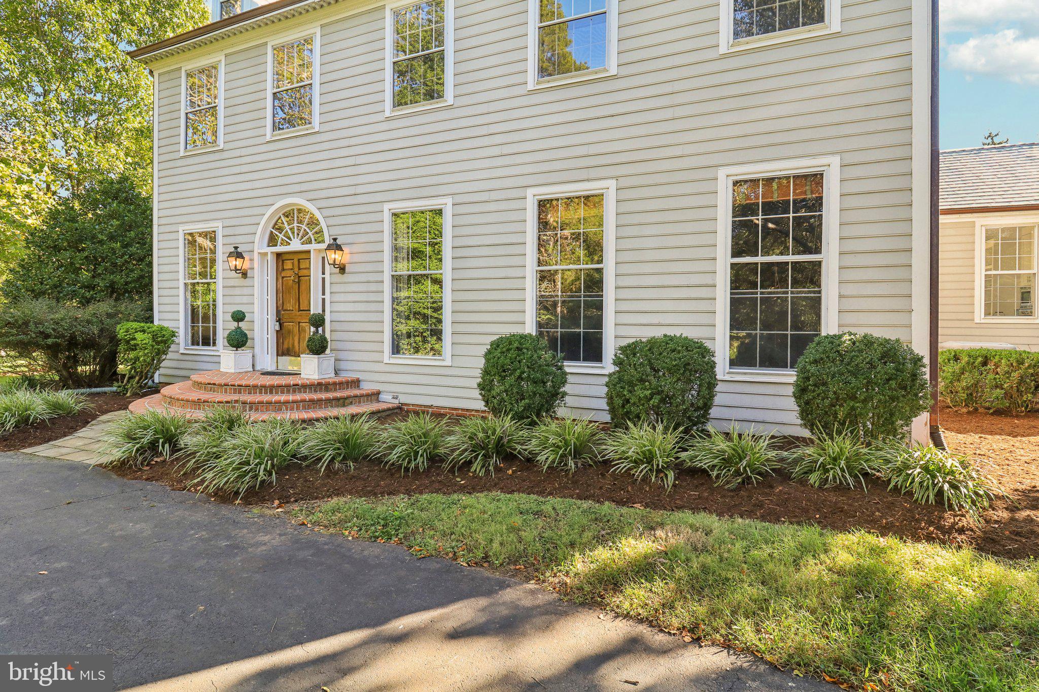 10650 Gunston Road Lorton, VA 22079 - Photo 71 of 73 a front view of a house with garden