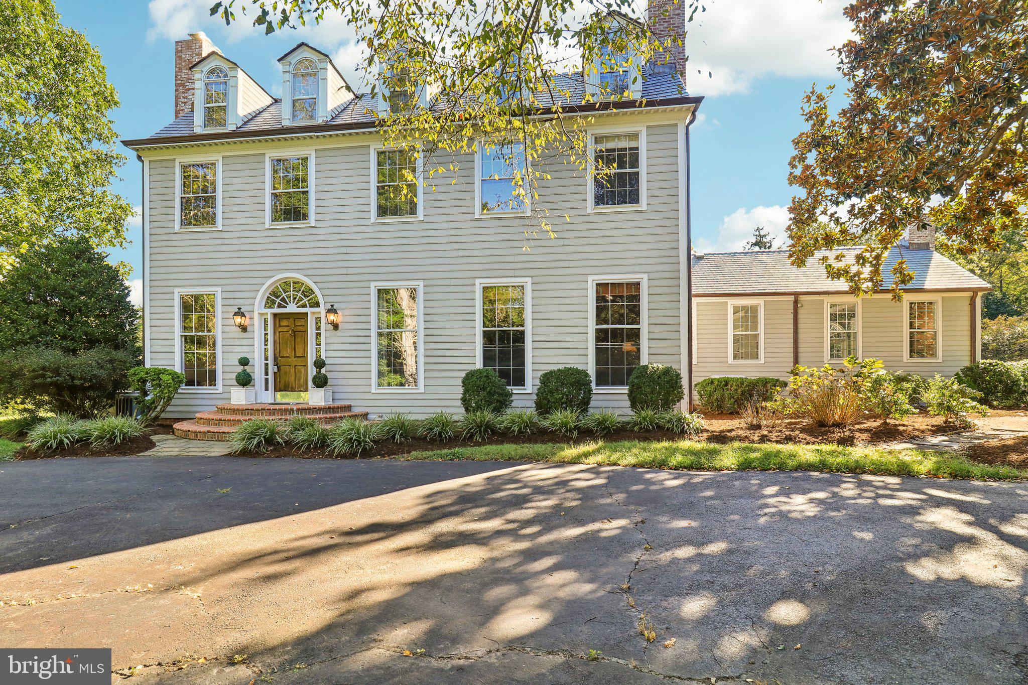 10650 Gunston Road Lorton, VA 22079 - Photo 72 of 73 a front view of a house with a yard and outdoor seating