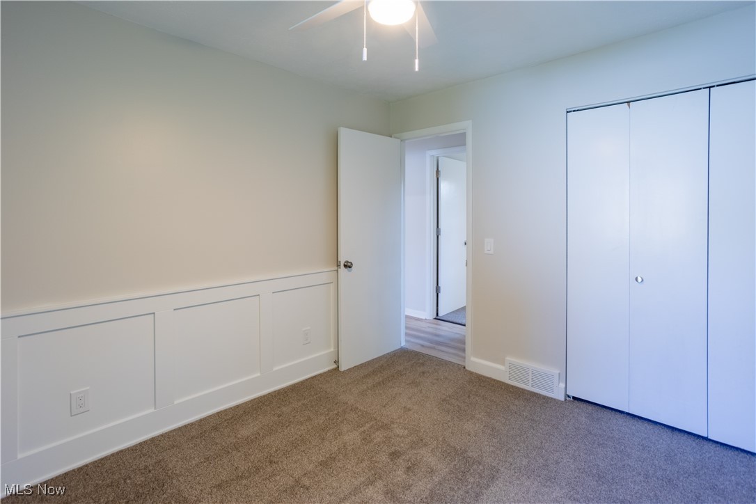 5591 Columbia Road Medina, OH 44256 - Photo 13 of 31 Primary Bedroom with wainscoting feature