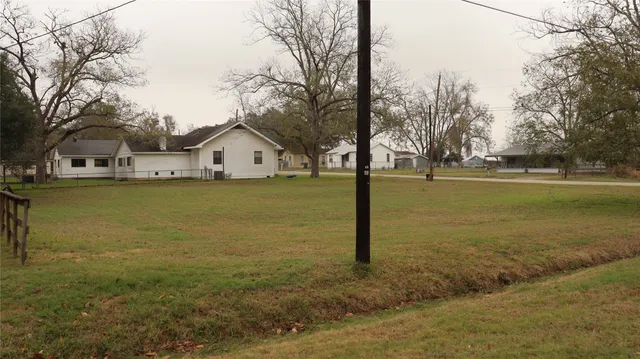 a view of a lake with a house in the background