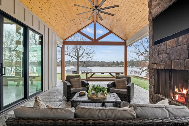 a view of a lake with table and chairs