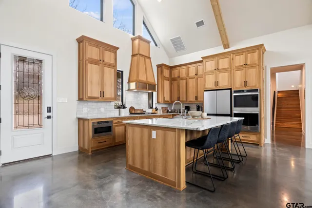 a view of kitchen with sink and wooden floor