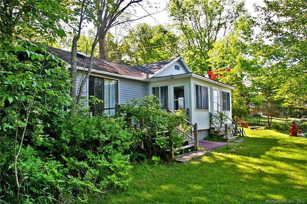 Classic Tyler Lake waterfront cottage inviting you to enjoy the summer ahead.