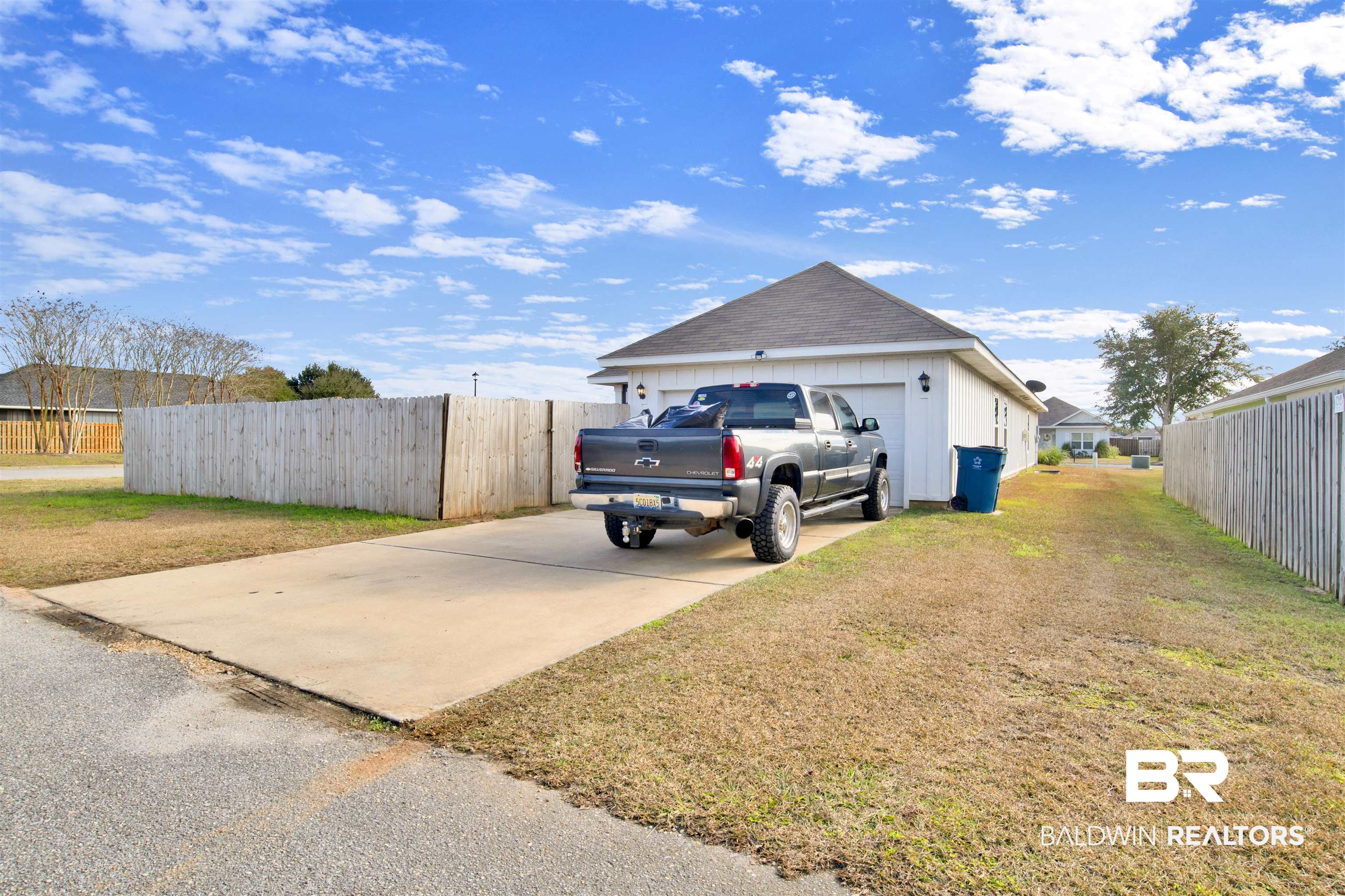 24101 Veranda Circle Elberta, AL 36530 - Photo 30 of 30 View of property exterior featuring a lawn and a garage