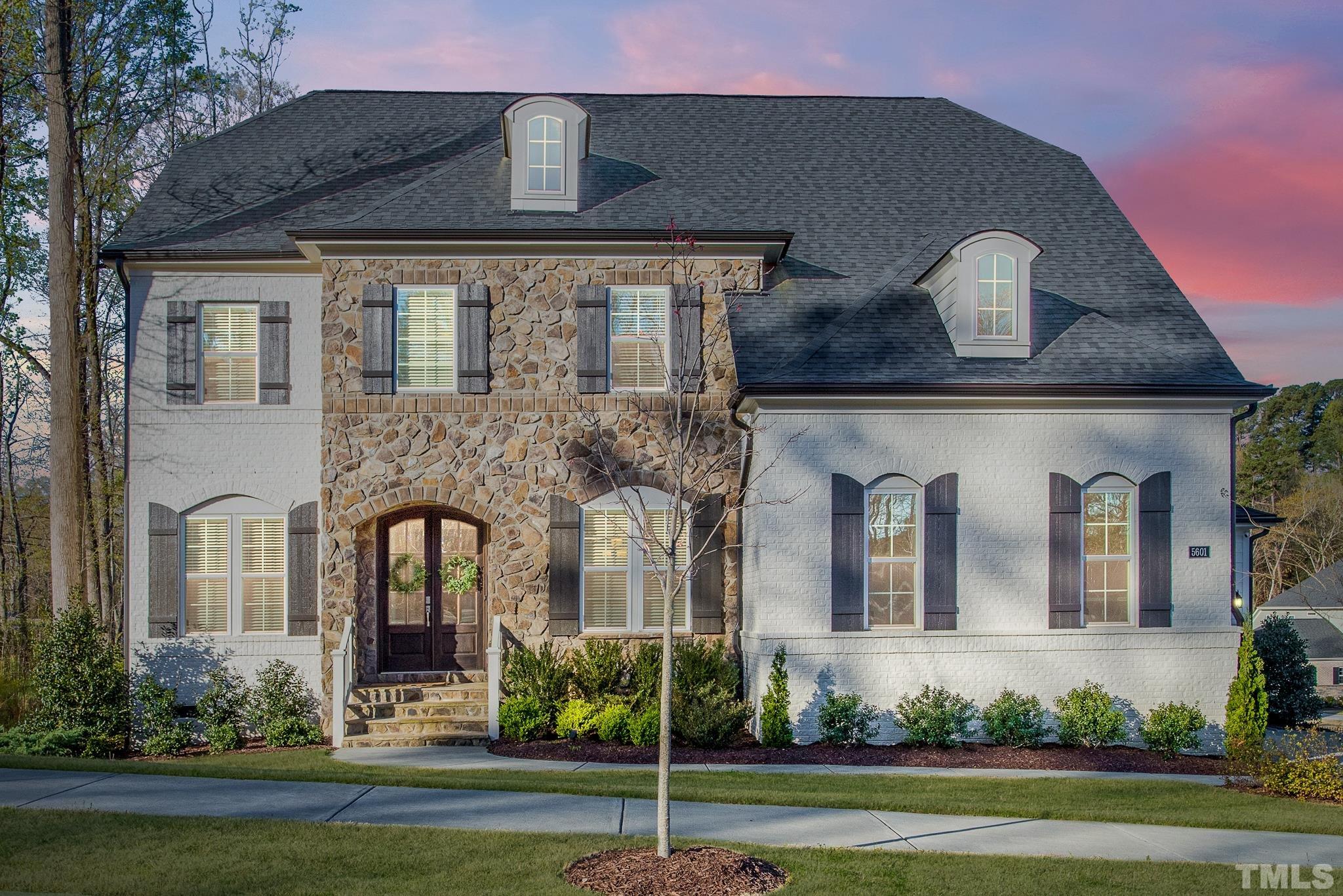 5601 Norcrest Street Raleigh, NC 27612 - Photo 1 of 41 a front view of a house with a garden