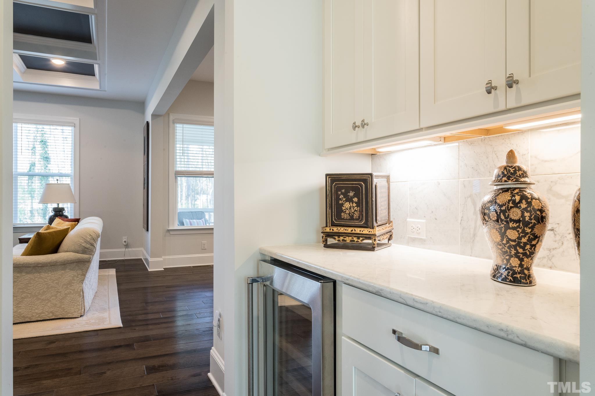 5601 Norcrest Street Raleigh, NC 27612 - Photo 11 of 41 a kitchen with a sink and cabinets with wooden floor