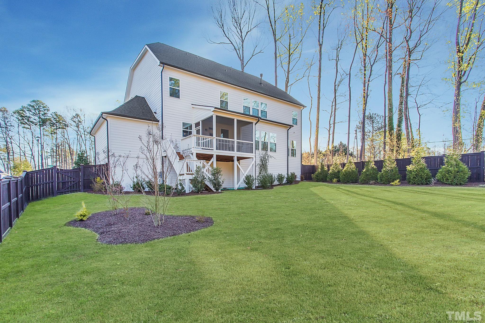 5601 Norcrest Street Raleigh, NC 27612 - Photo 12 of 41 a backyard of a house with lots of green space