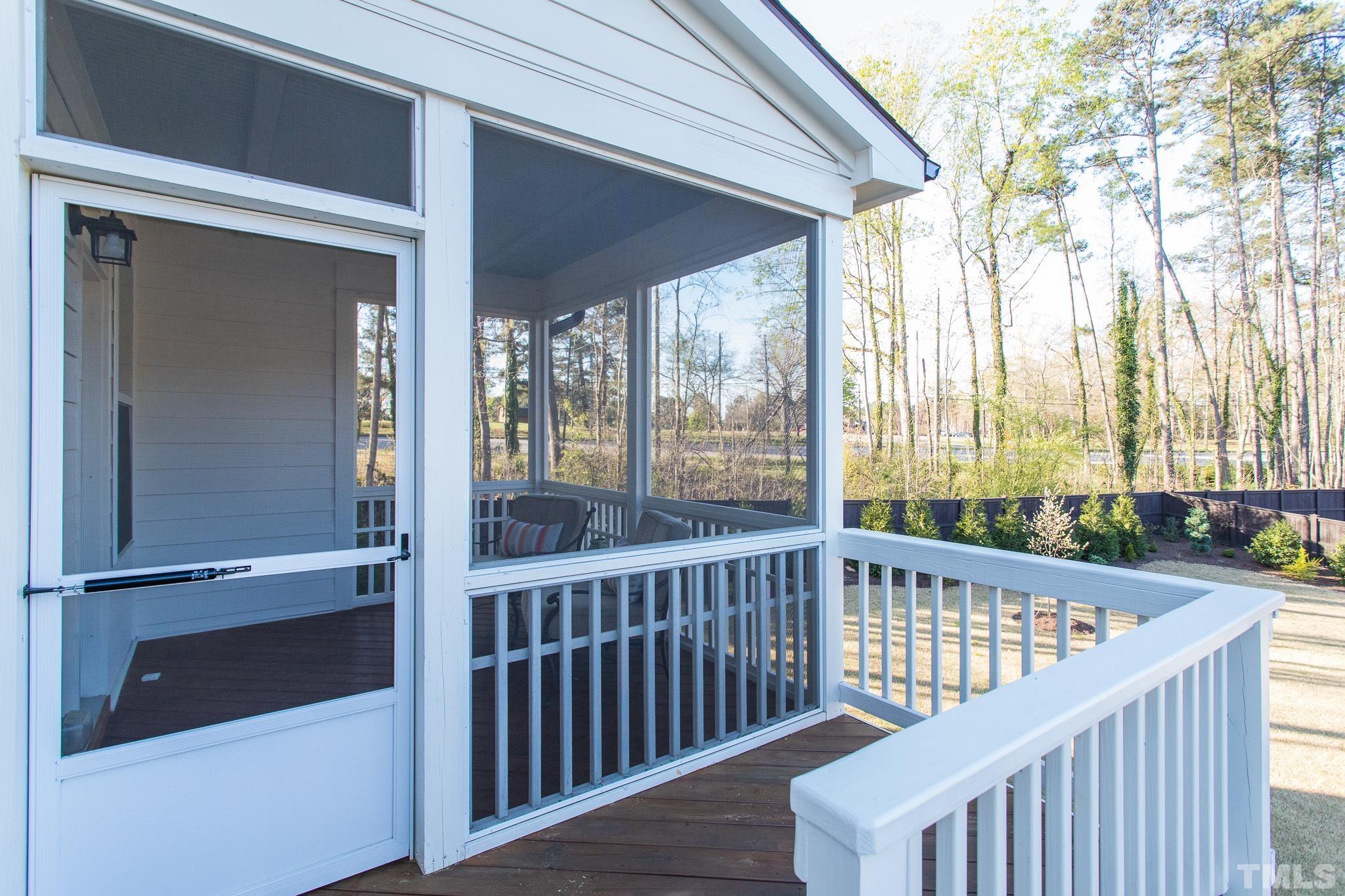 5601 Norcrest Street Raleigh, NC 27612 - Photo 14 of 41 a view of a porch with wooden floor and outdoor space