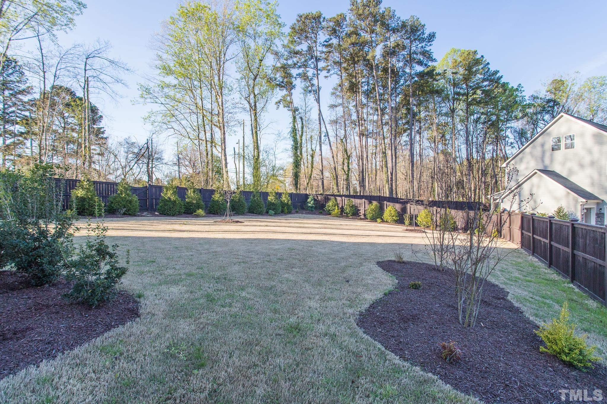 5601 Norcrest Street Raleigh, NC 27612 - Photo 16 of 41 a view of backyard with outdoor and green space