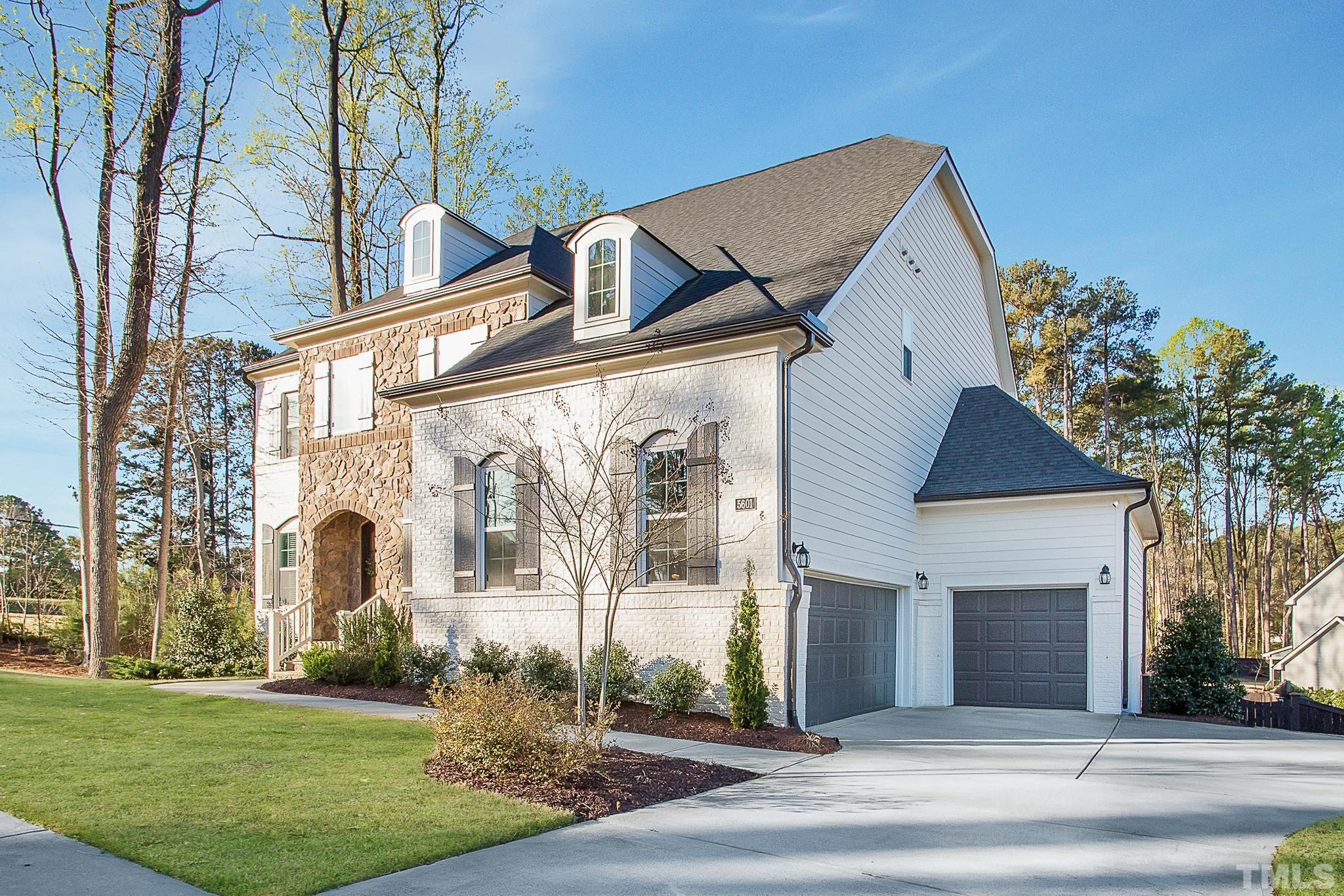 5601 Norcrest Street Raleigh, NC 27612 - Photo 2 of 41 front view of a house with a yard