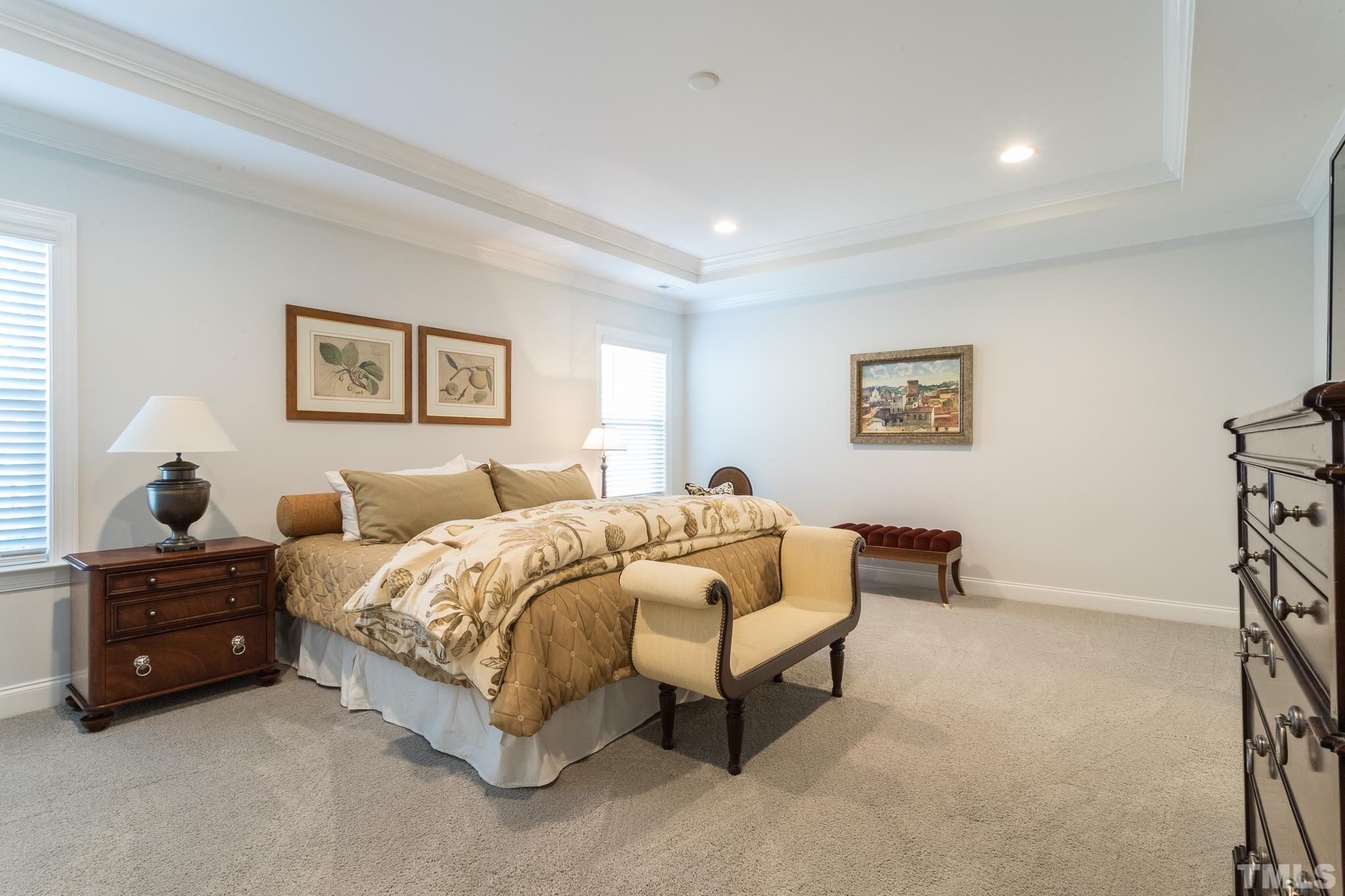 5601 Norcrest Street Raleigh, NC 27612 - Photo 23 of 41 a bedroom with a bed and a painting on the wall