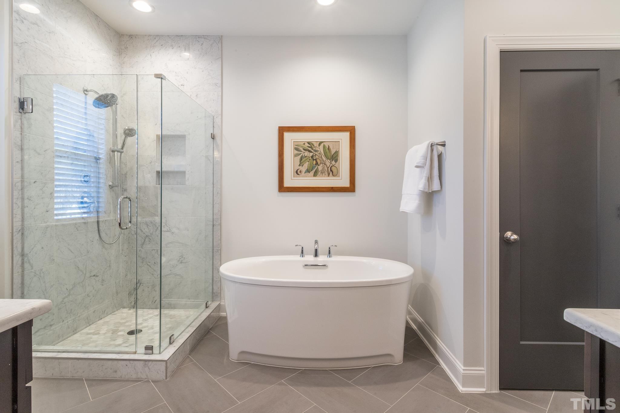 5601 Norcrest Street Raleigh, NC 27612 - Photo 24 of 41 a bathroom with a sink mirror toilet and bathtub